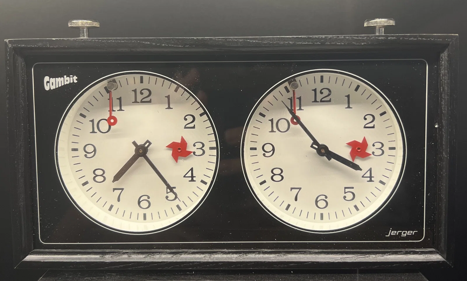 Jerger-branded Gambit chess clock in a black case