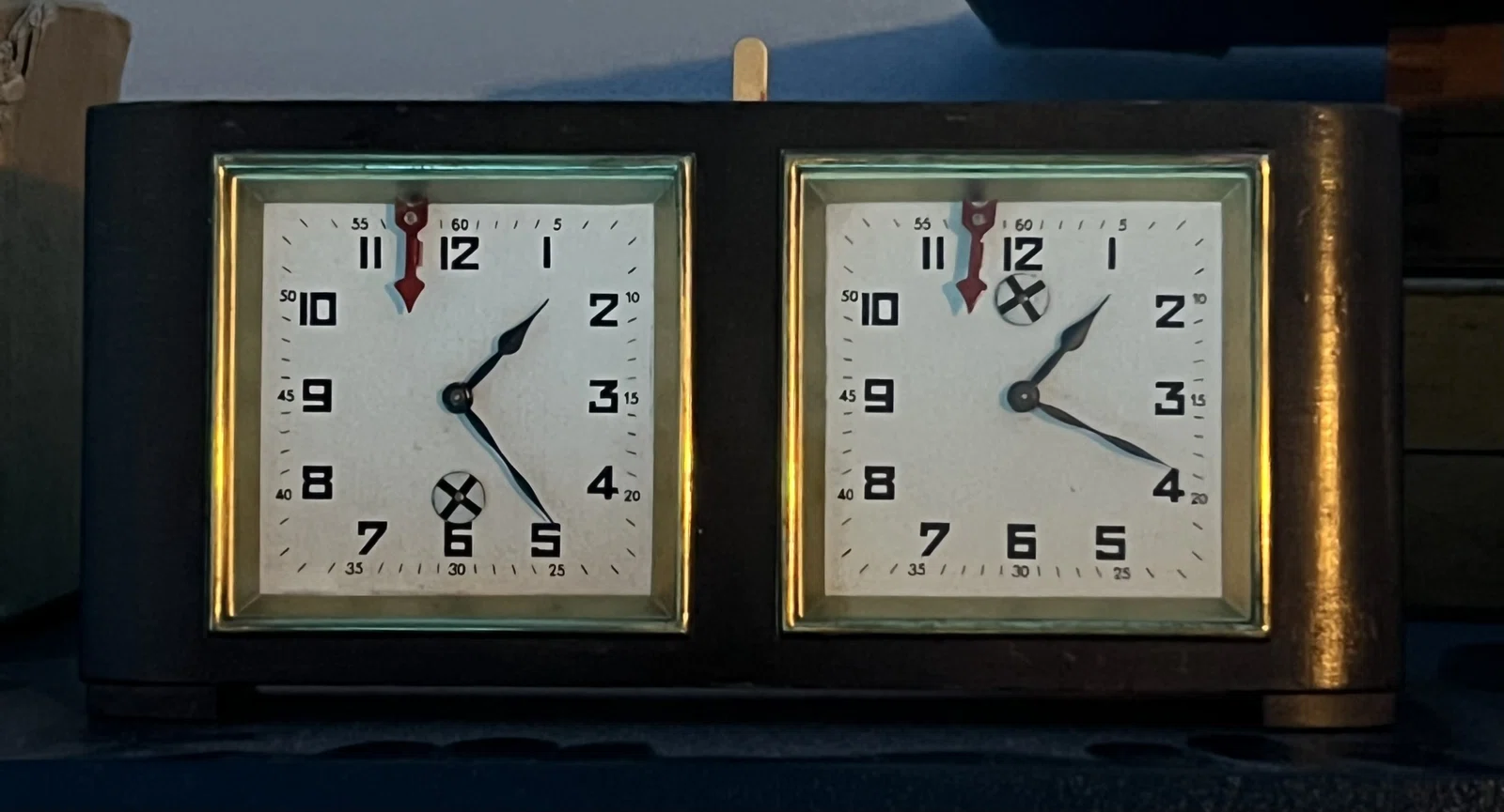 Unidentified chess clock with two square dials in a dark case